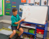 Student showing their maths working out on the whiteboard.